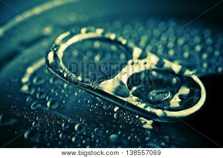 Close Up Opened Aliminium Jar With Water Drops
