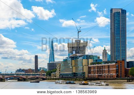 London UK - July 5 2016 - London cityscape including Blackfriars Railway Bridge Tate Modern The Shard Sea Container House OXO Tower and South Bank Tower
