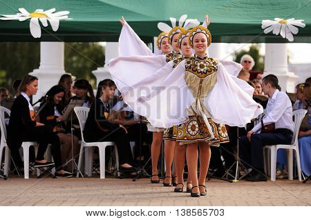 Orel, Russia - July 08, 2016: Russian Valentine Day  - Petr and Fevronia. Girl daincing in daisy dress