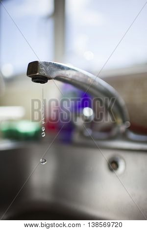 photo of a faucet head leaking in the kitchen