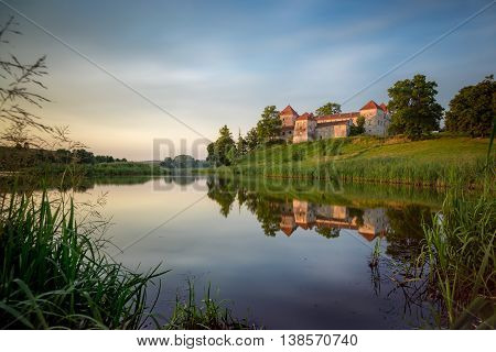 Summer evening view of old castle in Svirzh, Ukraine