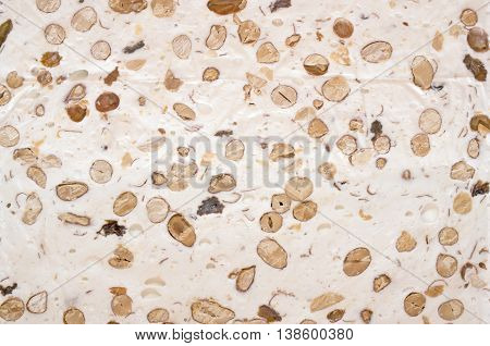 white nougat background, bar of nougat closeup