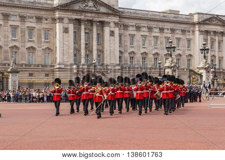 LONDON UK - 28TH JUNE 2016: Musical support from the Regimental Band during the Changing of the Guard ceremony at Buckingham Palace in the summer. The soldiers can be seen wearing scarlet tunics and bearskin caps