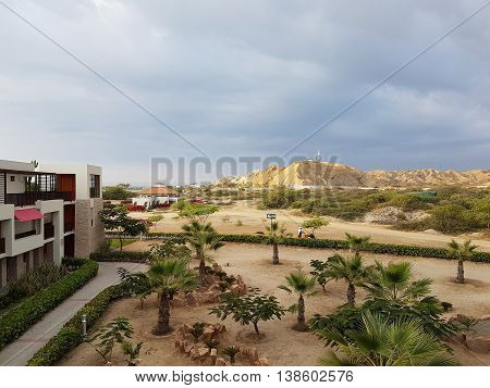 Building and desert in the desert of Piura