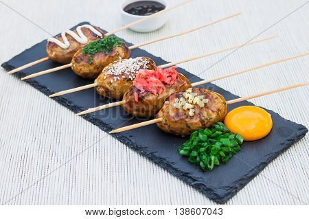 Tsukune - Japanese grilled chicken meatballs on a plate