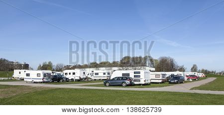 UPPSALA, SWEDEN ON MAY 06. View of caravans, campers and cars in Fyrishov camping on May 06, 2016 in Uppsala, Sweden. Road this side. Morning. Editorial use.