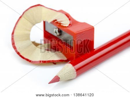 red pencil drawing and pencil sharpener close-up