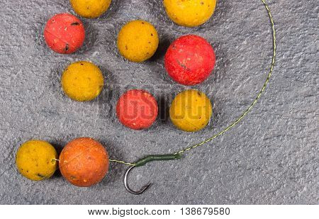 Carp Hook Boilies on black background. Close up.
