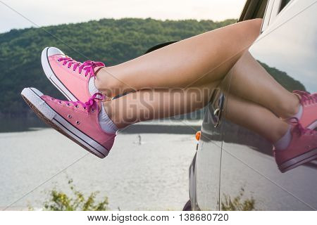 Legs Out Of The Car Window By The Lake