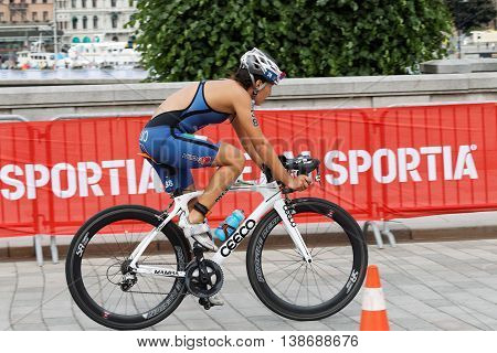 STOCKHOLM - JUL 02 2016: Side view of female triathlete cyclist Angelica Olmo Italy in the Women's ITU World Triathlon series event July 02 2016 in Stockholm Sweden