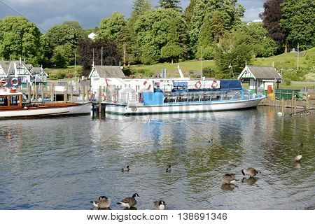 BOWNESS ON WINDERMERE, UK - JUNE 20, 2016: Pleasure cruise boats at the pier, Bowness on Windermere, Cumbria, UK