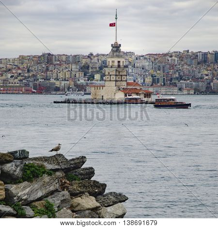 The Maiden's Tower (Turkish: Kiz Kulesi) also known as Leander's Tower since the medieval Byzantine period is a tower lying on a small islet located at the southern entrance of the Bosphorus strait 200 m from the coast of Uskudar in Istanbul Turkey.