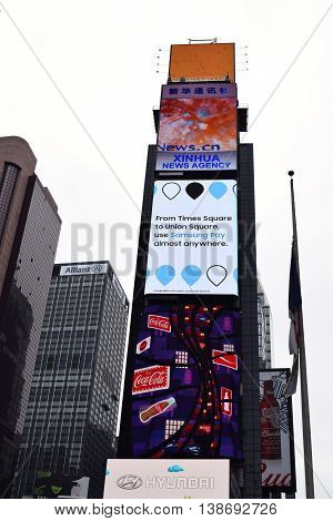 NEW YORK NY - May 7th 2016: Times Square buildings showing advertisements from Xinhua News Agency Samsung Coca-Cola and Hyundai