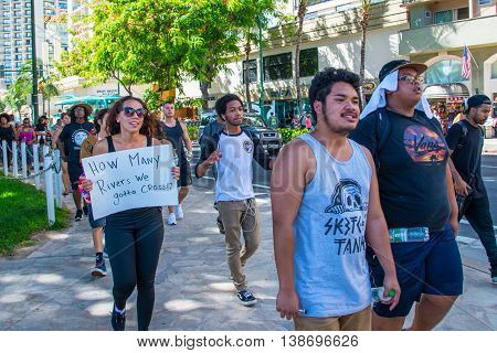 Honolulu, HI. USA  July 9, 2016  Approximately fifty or so Black Lives Matter protesters hit the strip in Waikiki on Saturday afternoon with chants of 
