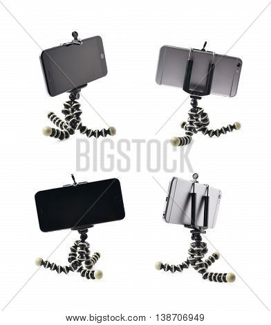 Smartphone set up on a tripod isolated over the white background, set of four different foreshortenings