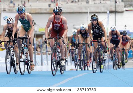 STOCKHOLM - JUL 02 2016: Large group of female triathlete cyclists cycling uphill in the Women's ITU World Triathlon series event July 02 2016 in Stockholm Sweden