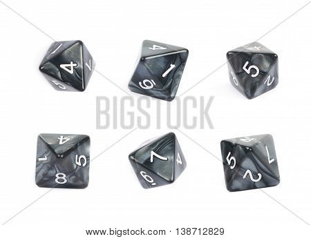 Roleplaying black polyhedral octahedron gaming plastic dice isolated over the white background, set of six different foreshortenings