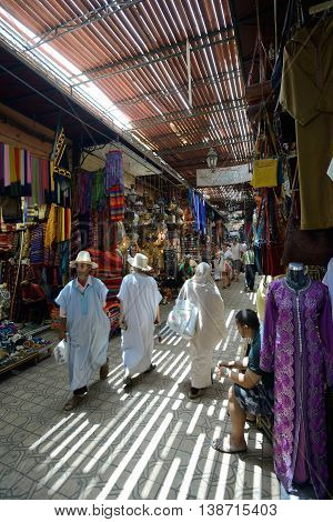 MARRAKESH - JULY 09: Unknown people in a market (souk), July 09, 2013 in a Marrakesh, Morocco. The traditional Berber market is one of the most important attractions of the city Marrakesh, Morocco
