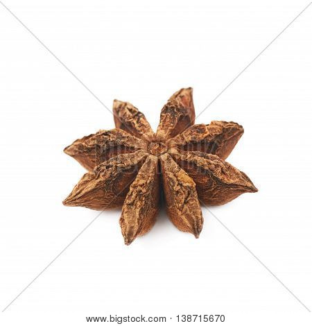 Single Chinese star anise seed isolated over the white background