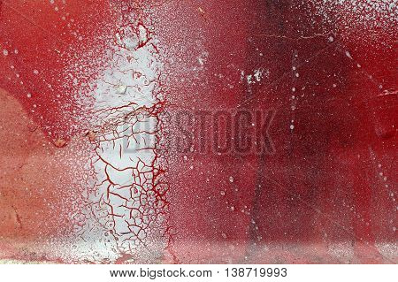 Cracked And Scratched Red And White Paint On Grunge Metal