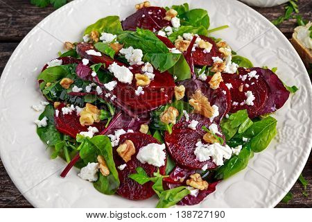 Healthy Beet Salad with fresh sweet baby spinach, kale lettuce, nuts, feta cheese and toast with melted cheese.
