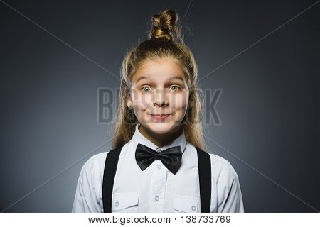 Closeup Portrait of happy girl going surprise isolated on gray background.