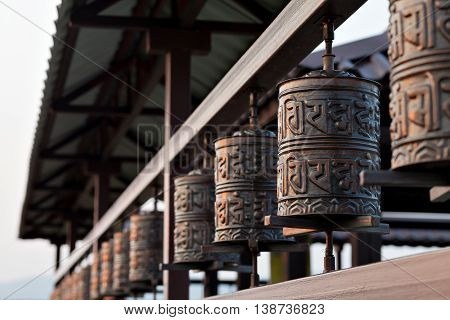 Religious prayer wheel for meditation in a Buddhist temple in Buryatia, Russia Ulan-Ude.