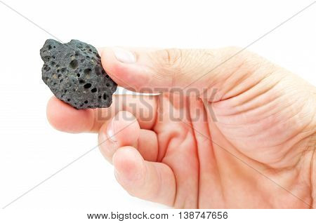 volcanic lava in hand isolated on a white background