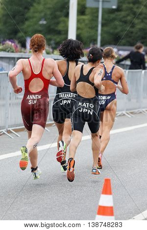 STOCKHOLM - JUL 02 2016: Rear view of group of running triathletes in the Women's ITU World Triathlon series event July 02 2016 in Stockholm Sweden