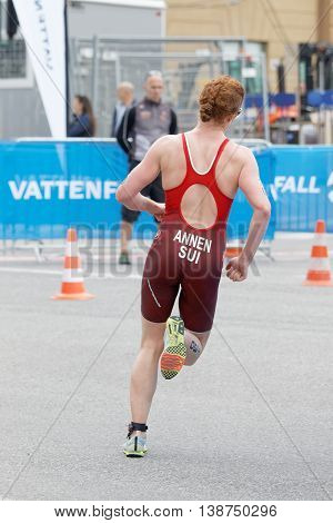 STOCKHOLM - JUL 02 2016: Triathlete Jolanda Annen running in a curve rear view in the Women's ITU World Triathlon series event July 02 2016 in Stockholm Sweden