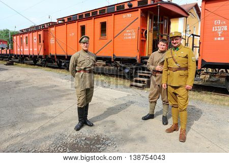 DOBRANY CZECH REPUBLIC - JUNE 17, 2016: Unidentified soldiers in historic Czech legionary uniforms as a guard of military armoured train. Historical reenactment. Reconstruction of russian civil war.