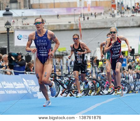 STOCKHOLM - JUL 02 2016: Group of triathletes running in the transition zone in the Women's ITU World Triathlon series event July 02 2016 in Stockholm Sweden