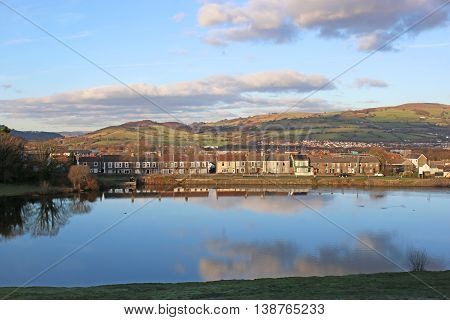 Town of Caerphilly by a lake in Wales