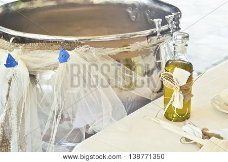 greek orthodox christening decoration with baptism oil, candles and the greek kolimbithra