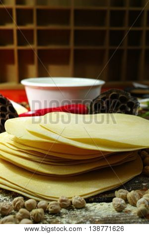 Colorful Indian food - papadum chickpea gram flour and spices on textured wooden table top