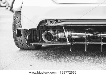 Double Exhaust Pipes Of A Modern Sports Car, Black And White