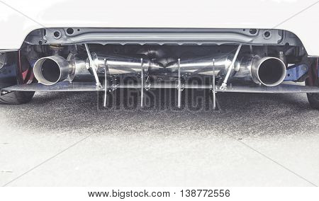 Double Exhaust Pipes Of A Modern Sports Car, Black And White