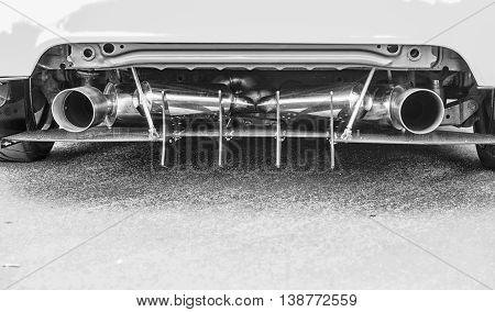 Double Exhaust Pipes Of A Modern Sports Car, Black And White