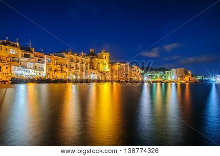 Ischia town at night. Mediterranean Sea coast bay of Naples Ischia island Italy