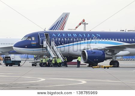 MOSCOW, RUSSIA - SEPTEMBER 26, 2014:  Airbus A320 Azerbaijan Airlines on the apron of Domodedovo Airport expects passenger compartment cleaning team.