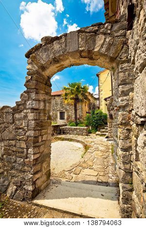 Town of Hum stone gate and street vertical view Istria Croatia