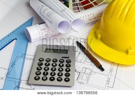An Office Desk With The Project Papers