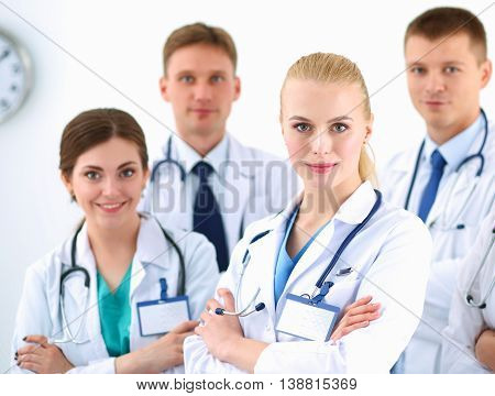 Portrait of group of smiling hospital colleagues standing together .