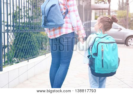Parent taking child to school