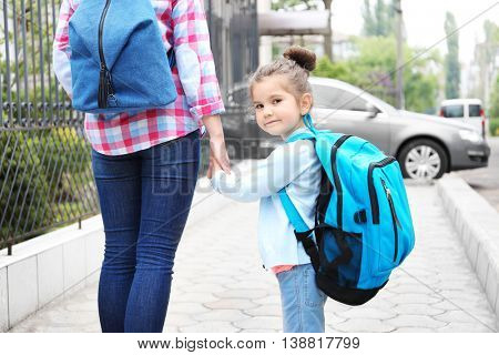 Parent taking child to school