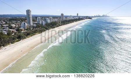 Aerial view of Burleigh beach as the sun rises over the ocean. Gold Coast, Australia