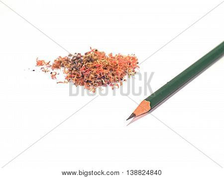 green pencil with pencil sawdust in its left side