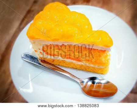 mandarin orange cake served in a plastic dish