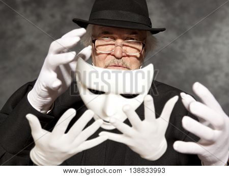 Magician in top hat showing trick. Magic, performance, circus, show concept