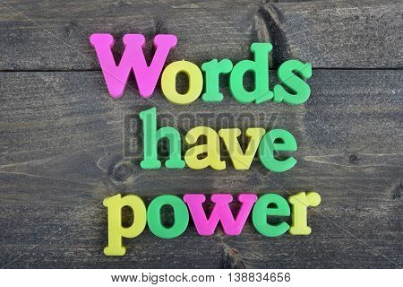 Words have power word on wooden table